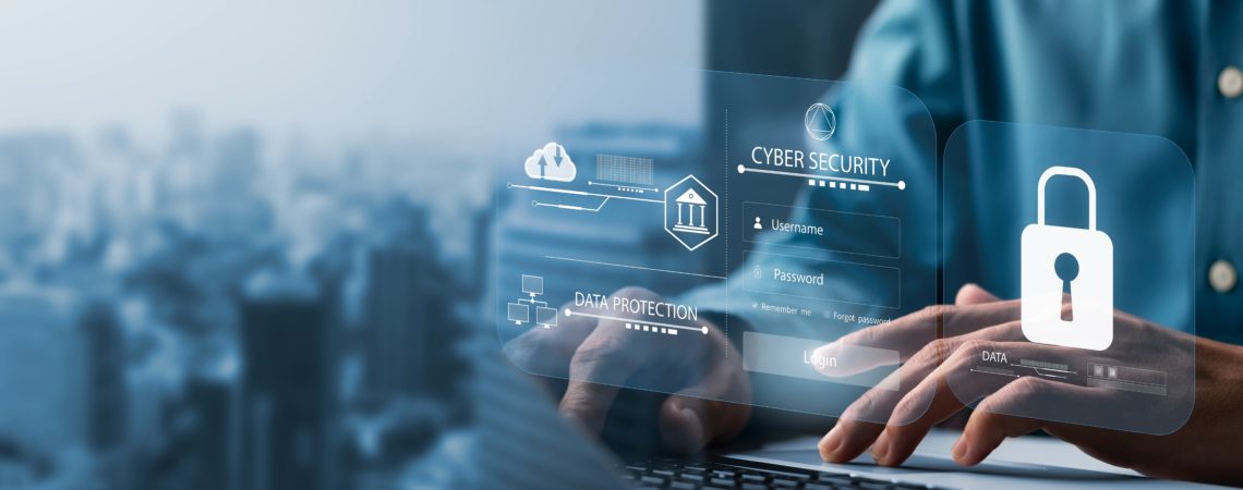 En hånd på laptop med illustrasjon foran som viser datasikkerhet
